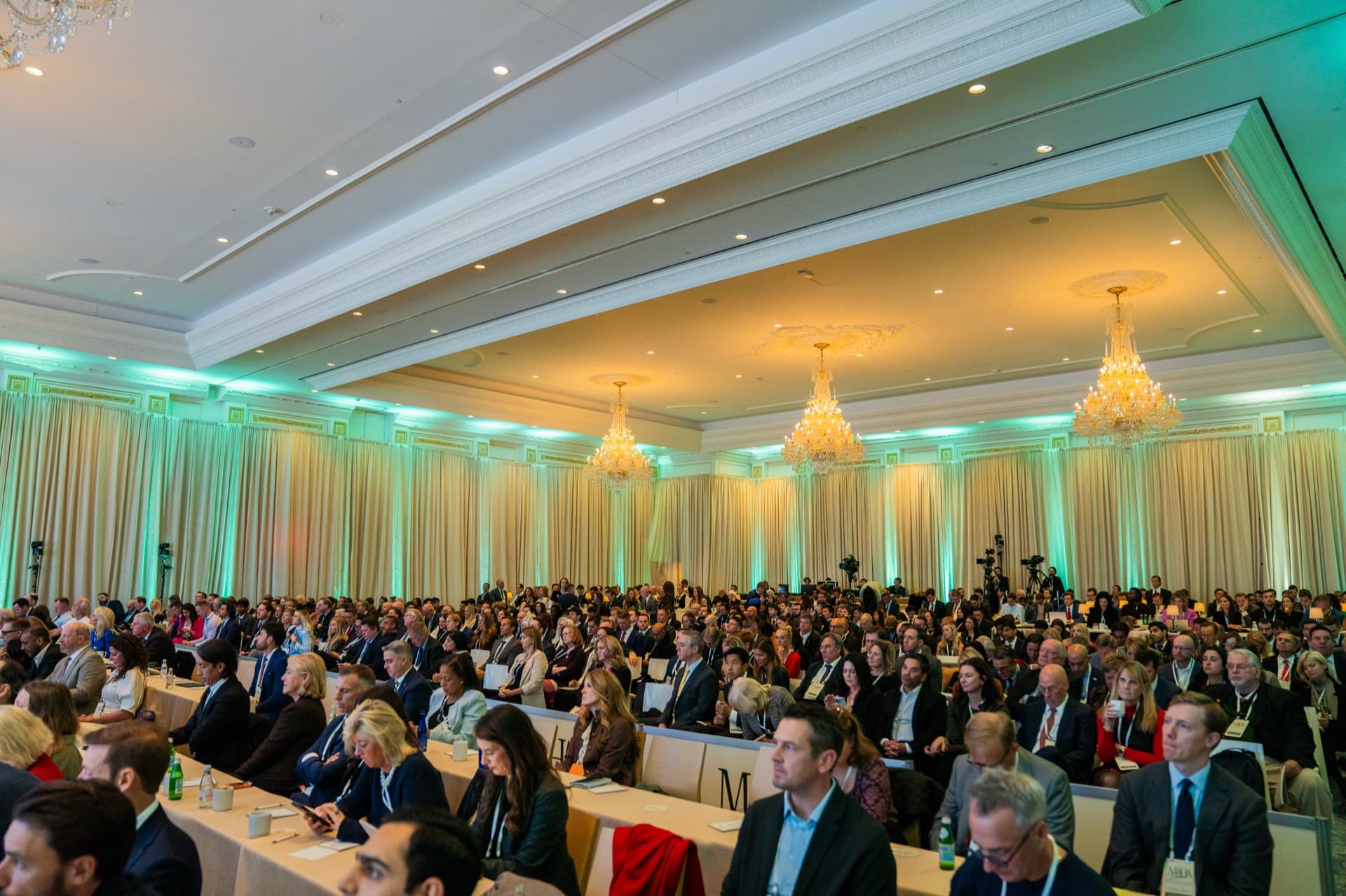 A wide view of the 2025 MAHA Summit audience in a chandelier-lit ballroom